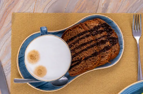 A cappuccino served with grilled bread