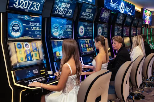 Guests playing side by side at the slot machines